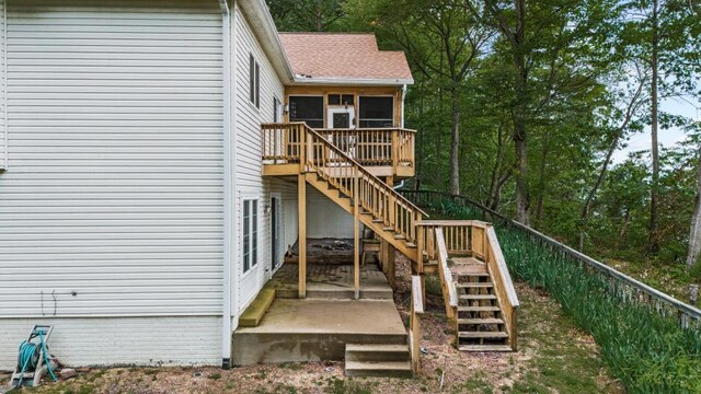 1753 N Independence Dr, Montross, VA 22520 - rear view of house with stairs, a deck, and a sunroom