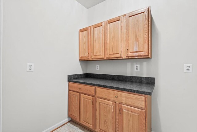1753 N Independence Dr, Montross, VA 22520 - kitchen featuring dark countertops and baseboards