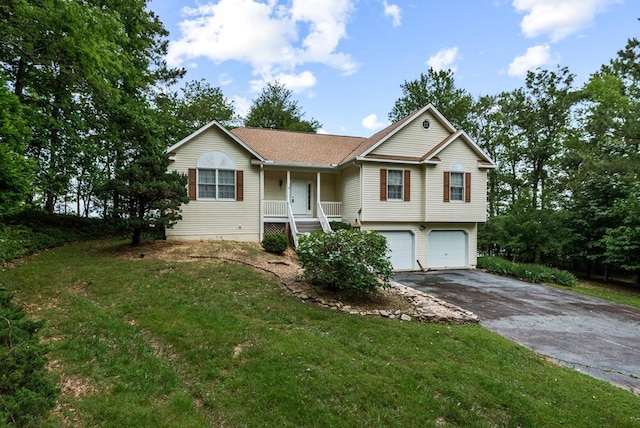 1753 N Independence Dr, Montross, VA 22520 - view of front of home featuring driveway, an attached garage, covered porch, and a front yard