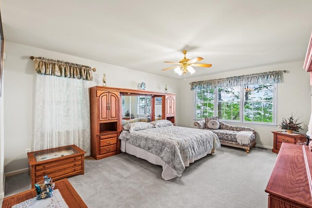 1753 N Independence Dr, Montross, VA 22520 - bedroom with light colored carpet, ceiling fan, and baseboards
