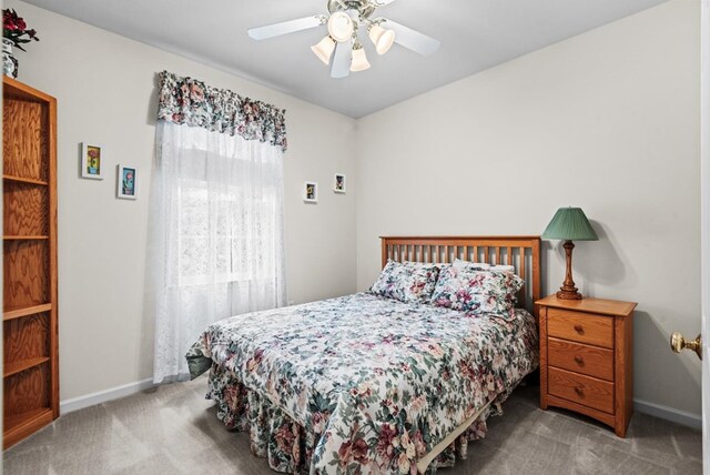 1753 N Independence Dr, Montross, VA 22520 - carpeted bedroom featuring baseboards and a ceiling fan