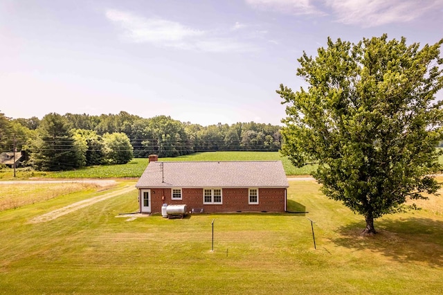 192 Morattico Rd, Lancaster, VA 22503 - view of home's exterior with a lawn, brick siding, and a chimney