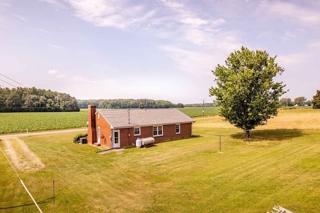 192 Morattico Rd, Lancaster, VA 22503 - back of house with a lawn, a chimney, a view of rural / pastoral area, brick siding, and driveway