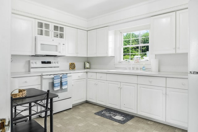 192 Morattico Rd, Lancaster, VA 22503 - kitchen featuring white appliances, ornamental molding, light countertops, white cabinets, and glass insert cabinets
