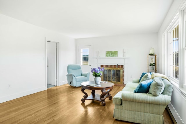 192 Morattico Rd, Lancaster, VA 22503 - living area with wood finished floors and a brick fireplace