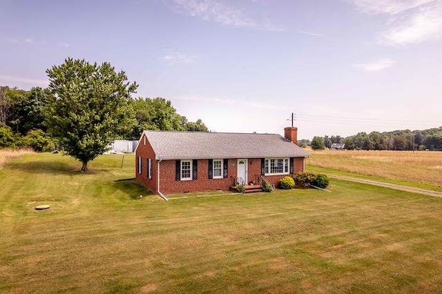 192 Morattico Rd, Lancaster, VA 22503 - view of front facade featuring brick siding, a chimney, and a front lawn
