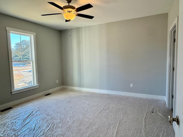 spare room with ceiling fan