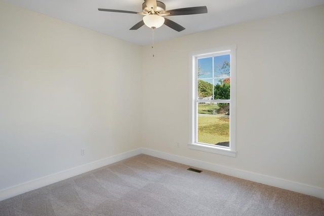 unfurnished room with ceiling fan and light colored carpet