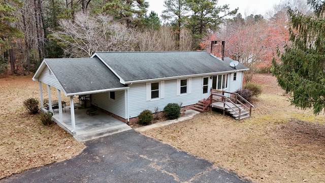 single story home with a carport