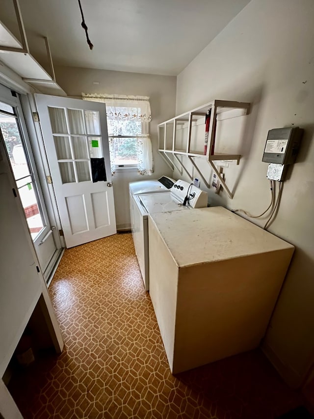 clothes washing area featuring washing machine and clothes dryer