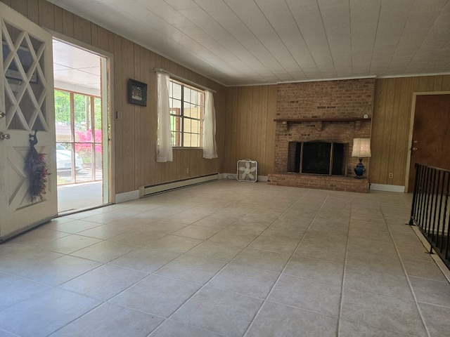 309 Riverview Dr, Heathsville, VA 22473 - unfurnished living room with light tile patterned floors, wood walls, a fireplace, and baseboard heating