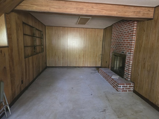 309 Riverview Dr, Heathsville, VA 22473 - interior space with concrete floors, wooden walls, a fireplace, and baseboards