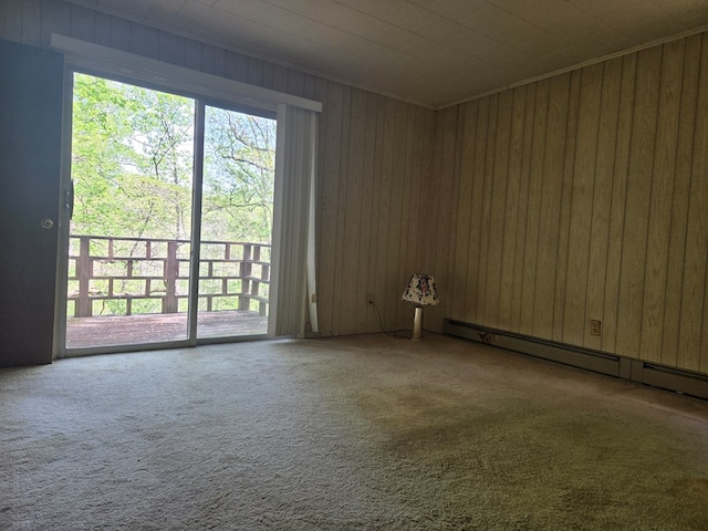 309 Riverview Dr, Heathsville, VA 22473 - unfurnished room featuring a baseboard radiator, wooden walls, and carpet