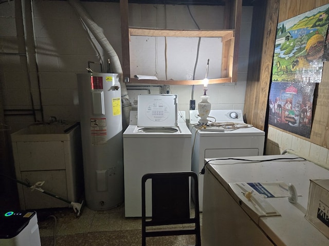 309 Riverview Dr, Heathsville, VA 22473 - laundry area with washing machine and dryer, concrete block wall, and electric water heater