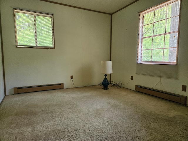 309 Riverview Dr, Heathsville, VA 22473 - carpeted empty room with ornamental molding, a baseboard radiator, and plenty of natural light