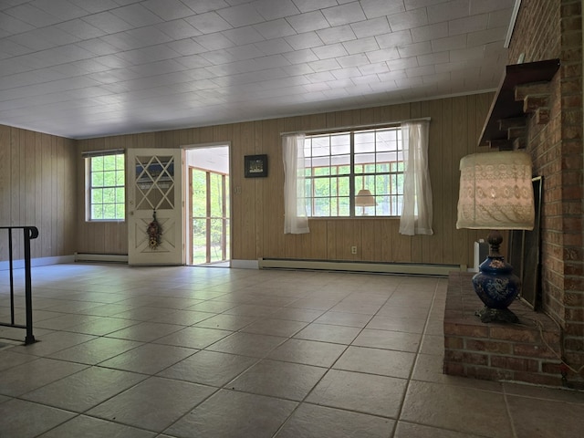 309 Riverview Dr, Heathsville, VA 22473 - unfurnished living room featuring a baseboard heating unit, a baseboard radiator, tile patterned floors, and wooden walls