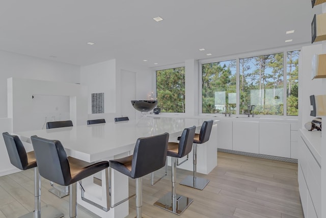 dining space featuring light wood-type flooring