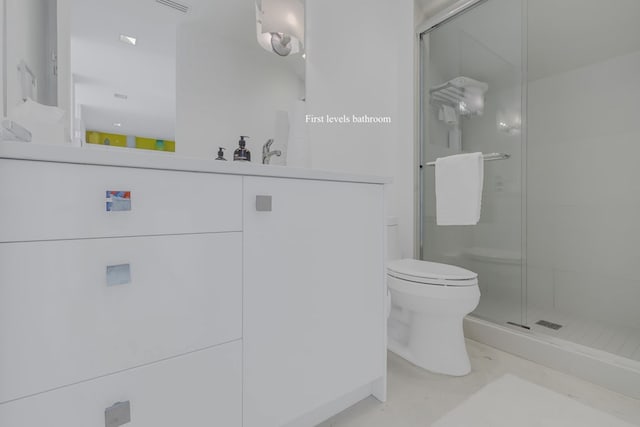 bathroom with vanity, toilet, and walk in shower