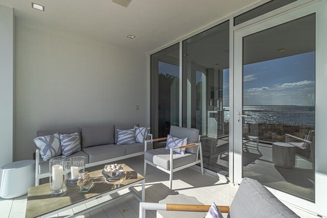 living room with floor to ceiling windows