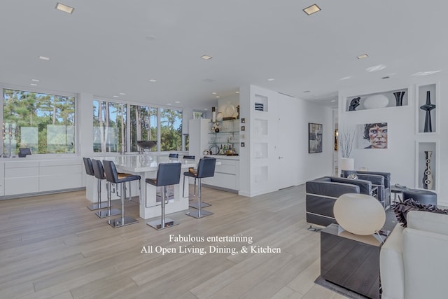 dining space with light wood-type flooring