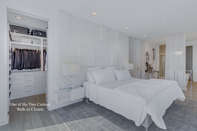 bedroom with dark wood-type flooring and a closet