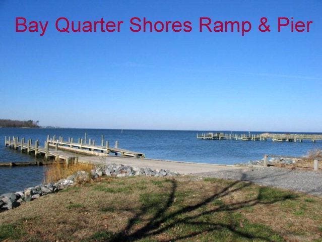 dock area with a view of the beach and a water view