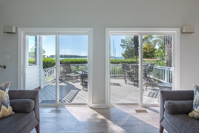 1032 Fishing Bay Rd, Deltaville, VA 23043 - doorway with wood finished floors and baseboards