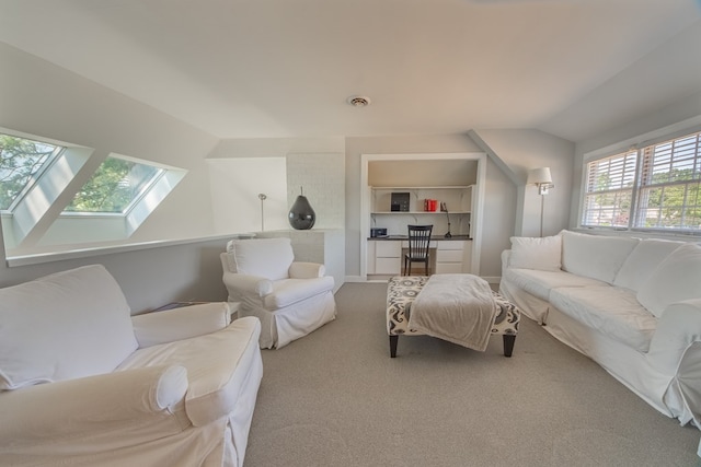 1032 Fishing Bay Rd, Deltaville, VA 23043 - living room with carpet flooring, a skylight, and vaulted ceiling