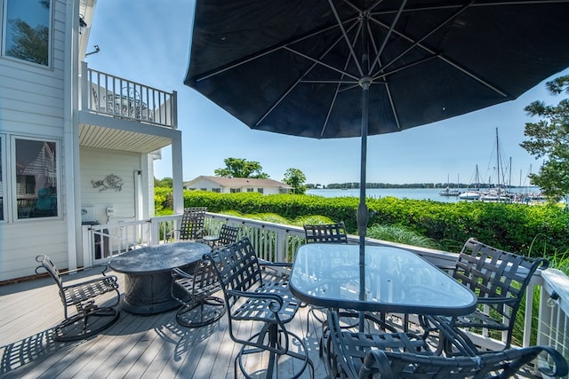1032 Fishing Bay Rd, Deltaville, VA 23043 - wooden deck with outdoor dining space and a water view
