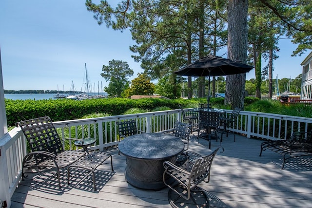 1032 Fishing Bay Rd, Deltaville, VA 23043 - wooden terrace featuring outdoor dining space and a water view