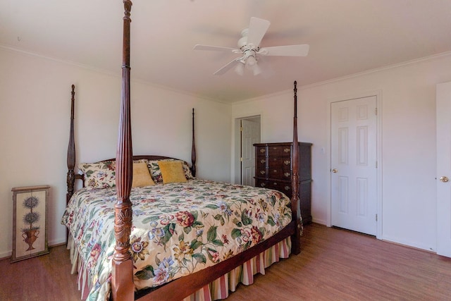 bedroom featuring crown molding and wood finished floors