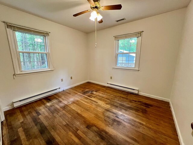 2048 Lake Rd, Lottsburg, VA 22511 - unfurnished room featuring baseboard heating, hardwood / wood-style flooring, a ceiling fan, and baseboards