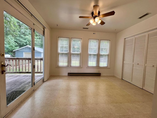 2048 Lake Rd, Lottsburg, VA 22511 - unfurnished sunroom featuring a baseboard radiator and healthy amount of natural light