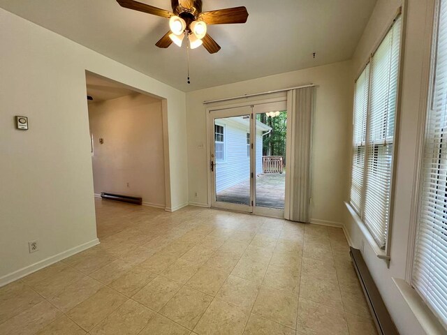 2048 Lake Rd, Lottsburg, VA 22511 - spare room featuring ceiling fan, baseboards, and light tile patterned floors