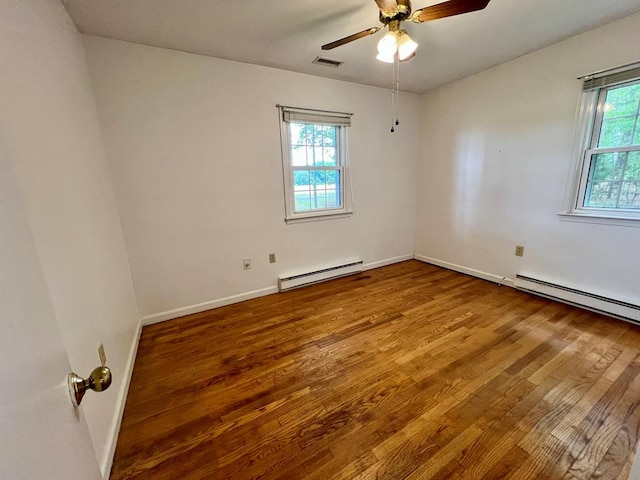 2048 Lake Rd, Lottsburg, VA 22511 - unfurnished room with baseboard heating, wood finished floors, ceiling fan, and baseboards