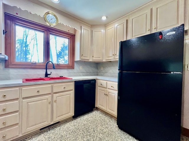 kitchen featuring sink and black appliances