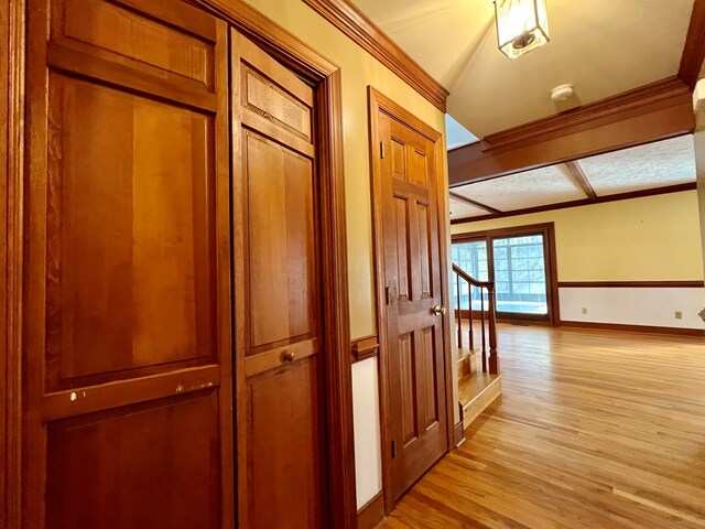 1113 Dillard St, Tappahannock, VA 22520 - corridor featuring light wood-style flooring, baseboards, coffered ceiling, ornamental molding, and stairway