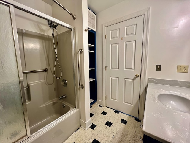 bathroom featuring  shower combination and vanity