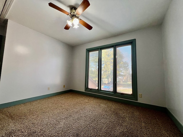 carpeted empty room with ceiling fan