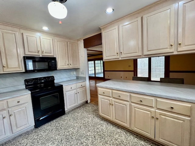 kitchen with tasteful backsplash and black appliances