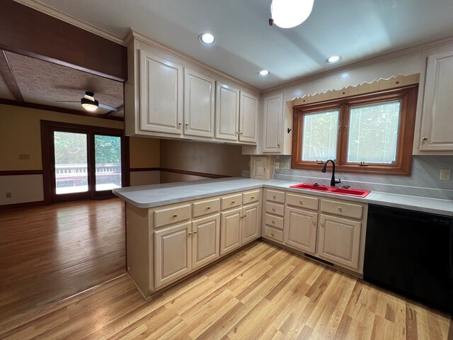 1113 Dillard St, Tappahannock, VA 22520 - kitchen featuring dishwasher, a sink, light wood finished floors, healthy amount of natural light, and crown molding