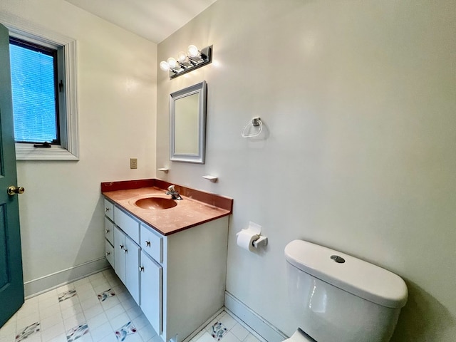 1113 Dillard St, Tappahannock, VA 22520 - half bath featuring baseboards, toilet, and vanity