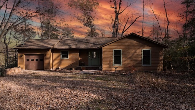 single story home featuring a garage