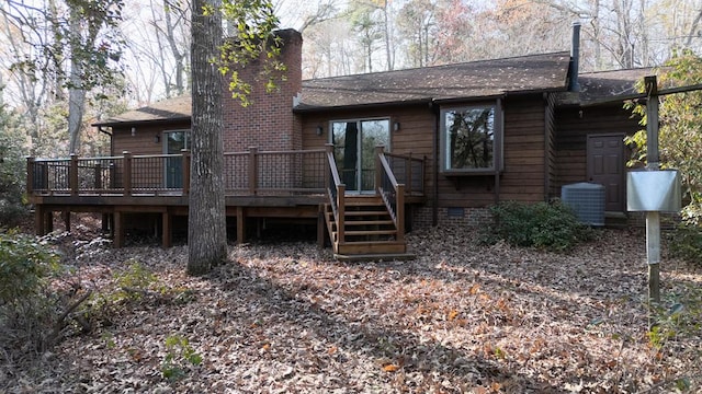 back of property with central air condition unit and a deck