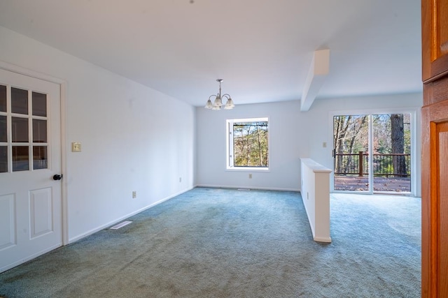 unfurnished living room featuring carpet flooring, beam ceiling, and a notable chandelier