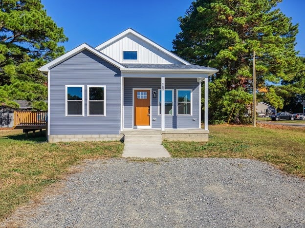 bungalow-style house with a front yard