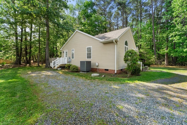326 Chase St, Kilmarnock, VA 22482 - view of property exterior featuring crawl space, roof with shingles, central AC unit, and a yard