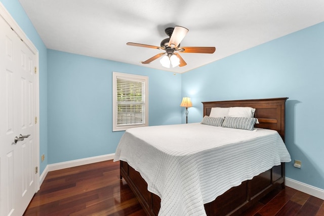 326 Chase St, Kilmarnock, VA 22482 - bedroom with baseboards, dark wood-type flooring, a closet, and ceiling fan