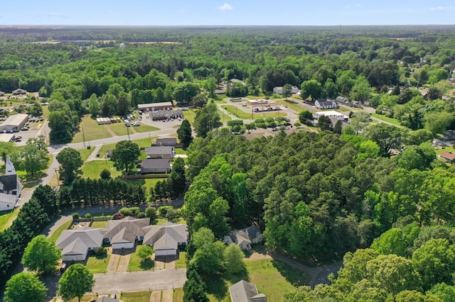 326 Chase St, Kilmarnock, VA 22482 - aerial view of property and surrounding area featuring a heavily wooded area and nearby suburban area