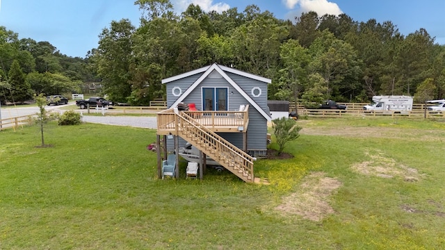 1150 Brammer Dr, Heathsville, VA 22473 - rear view of house featuring stairs, a deck, and a view of trees